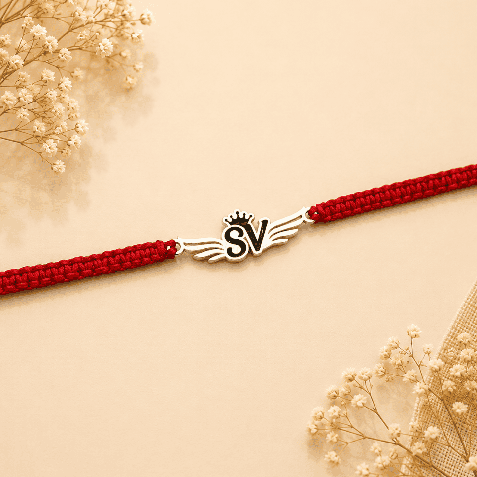 initial with crown rakhi_925 silver rakhis_rakhis for raksha bandhan_rakhis_gifts_raksha bandhan_special rakhis_brother sister gifts 925 SILVER DESIGNER RAKHI WITH WINGS & CROWN - Image 1